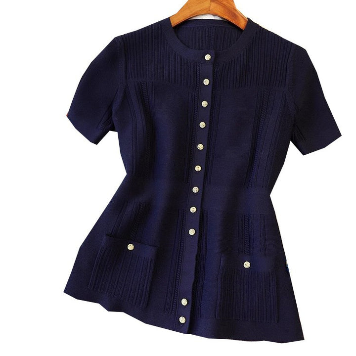 Dame strikbluse med struktureret design og praktiske lommer Stilla