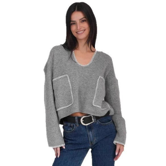 Kvinders hyggelige cropped sweater med asymmetrisk design og praktiske lommer Stilla