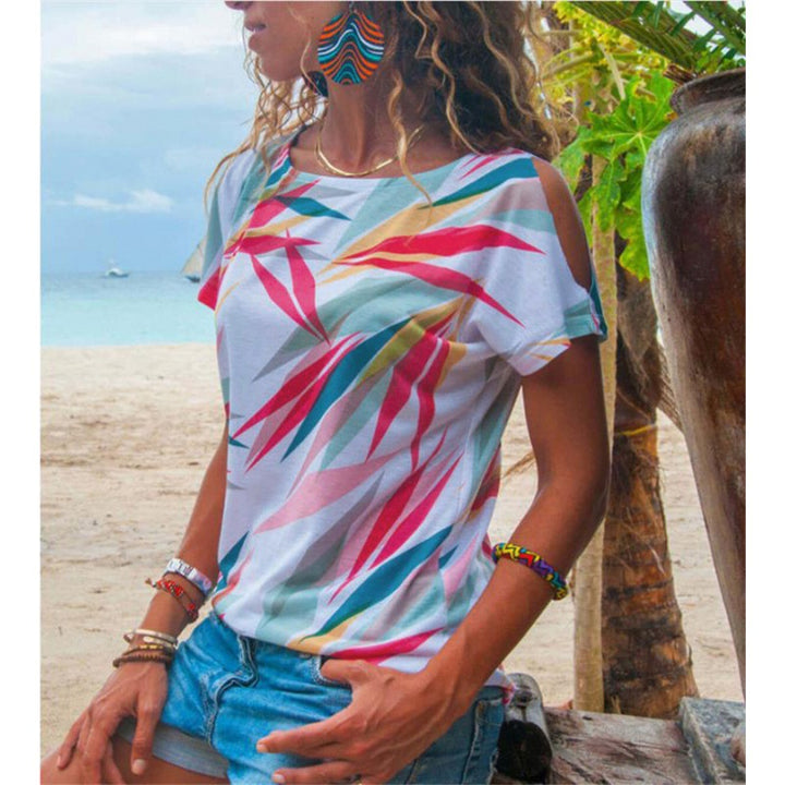 Kvinders T-shirt med asymmetrisk snit og farverigt bladmotiv Stilla