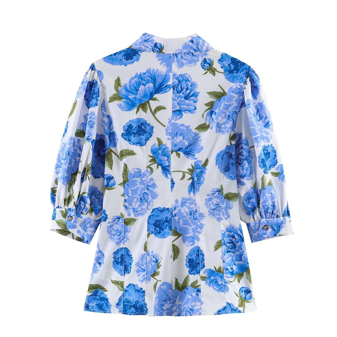 Damebluse med blomstermønster og elegante pufærmer Skovae
