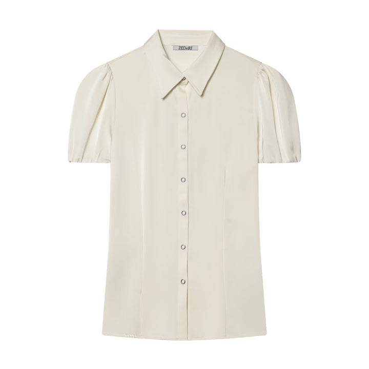 Damebluse med korte pufærmer og elegant knapliste Skovae