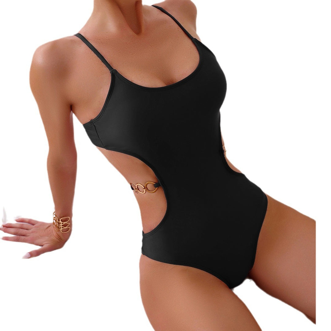 Dame enstykke badedragt med stilfuld cut-out design og gyldne accenter Stilla