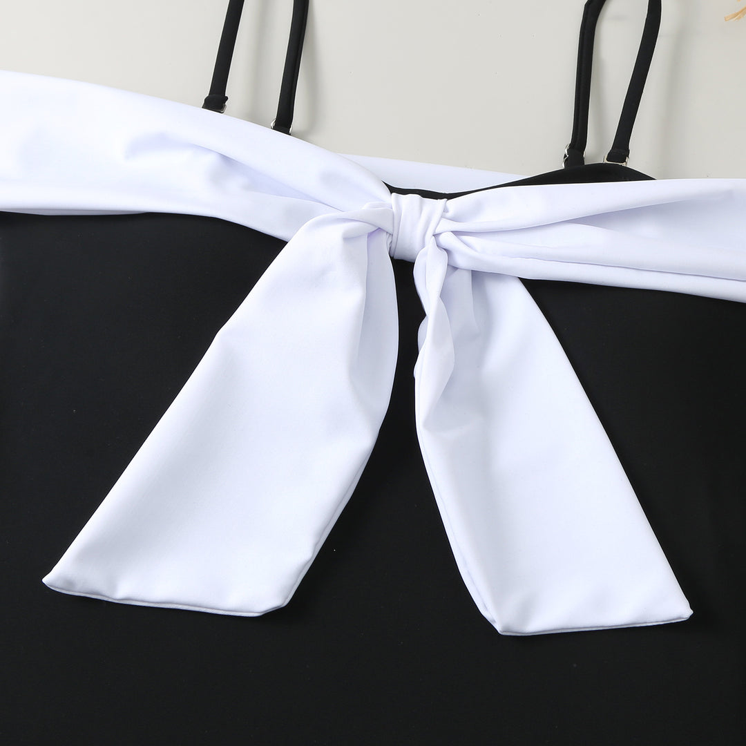 Dame one-piece badedragt med elegant indpakningsdesign og høj benåbning Skovae
