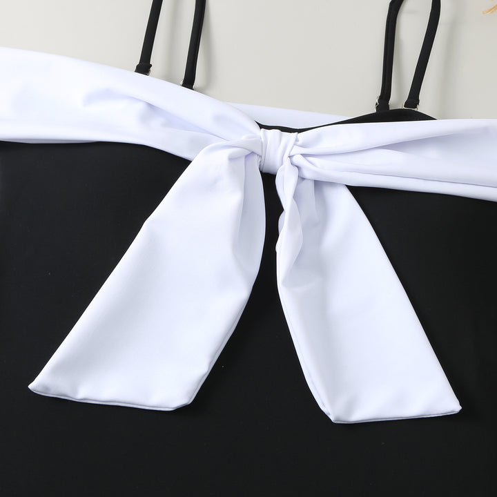 Dame one-piece badedragt med elegant indpakningsdesign og høj benåbning Skovae