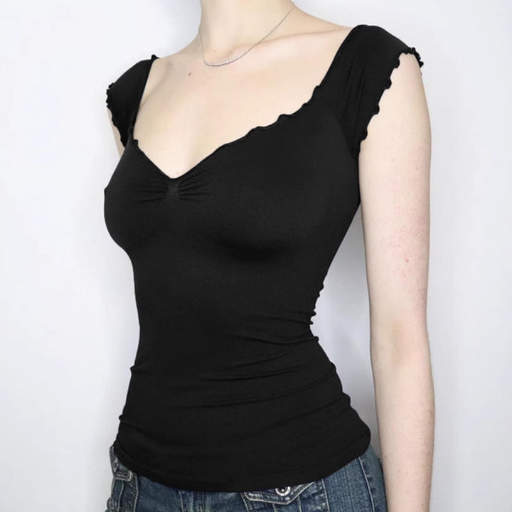 Dame elegant top med flæse detaljer og off-shoulder design Skovae