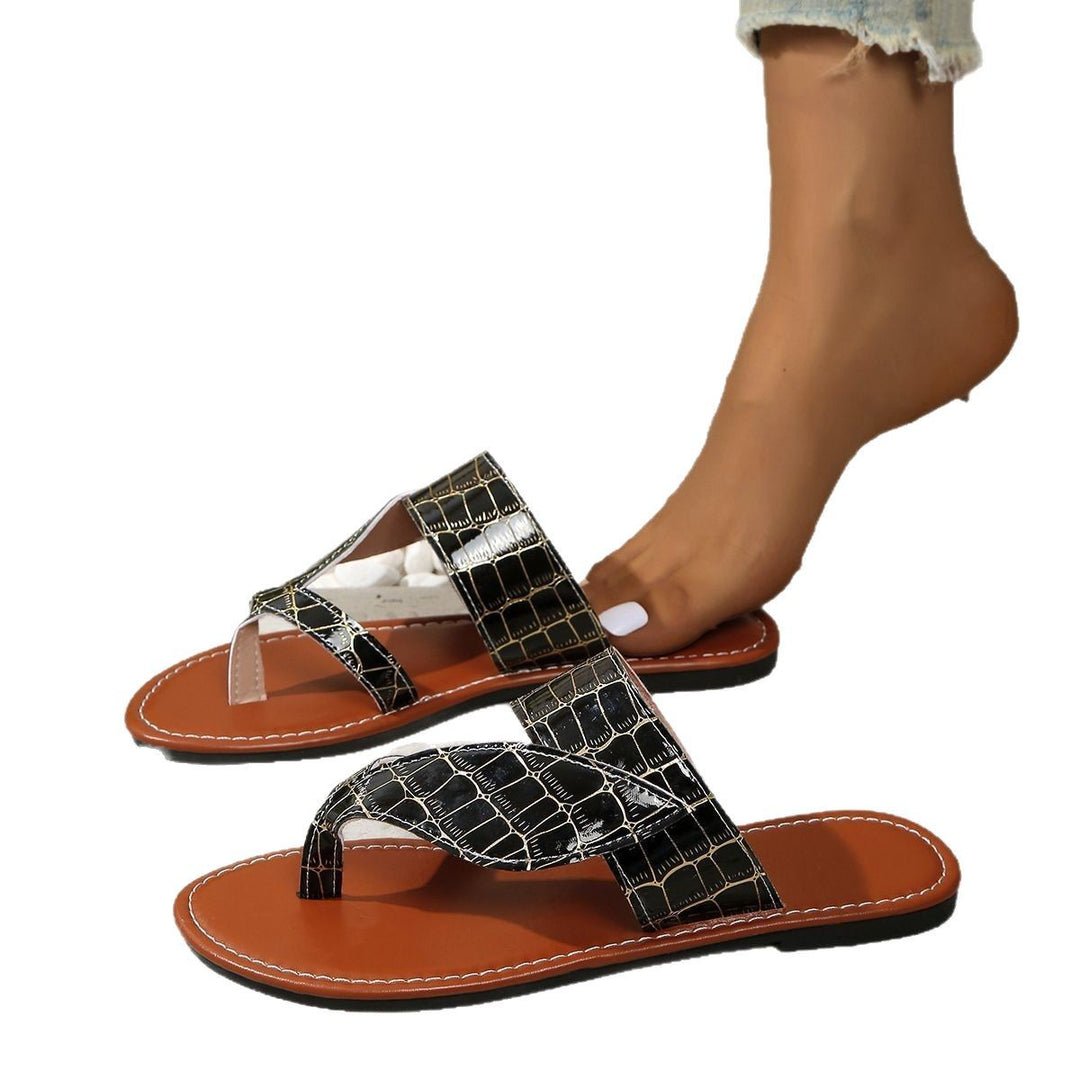 Dame pantolettet med elegant krydsdesign og moderne krokopráge detalje Stilla