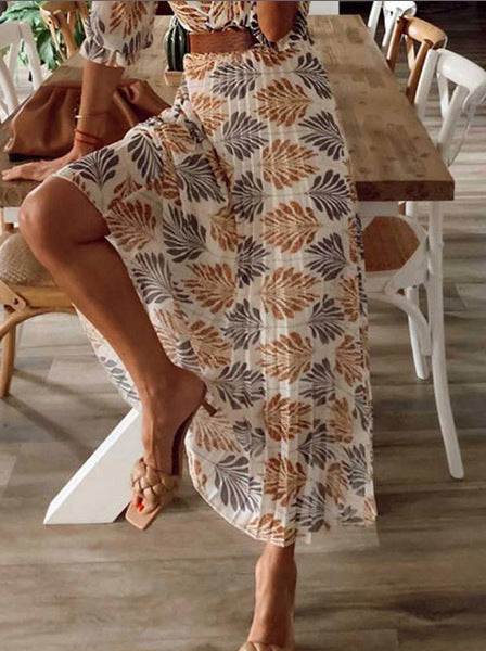 Dame Maxi-kjole med floralt mønster og feminin indpakningslook Stilla