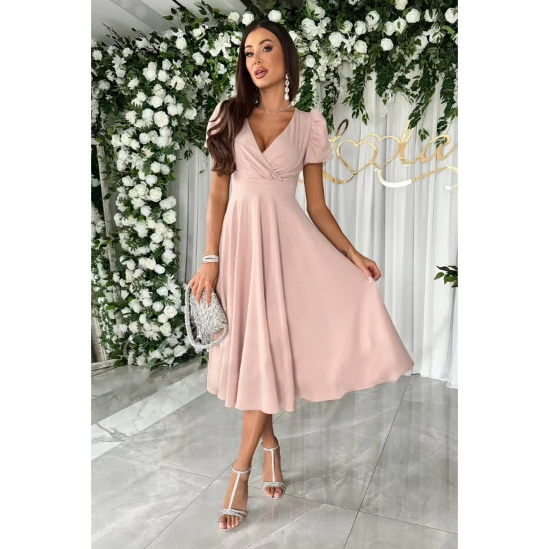 Dame elegant omslagskjole med voluminøse puffærmer og tidløst design Stilla