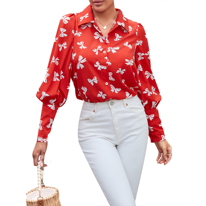 Kvindernes elegante bluse med blomster mønstre og pufærmer Stilla