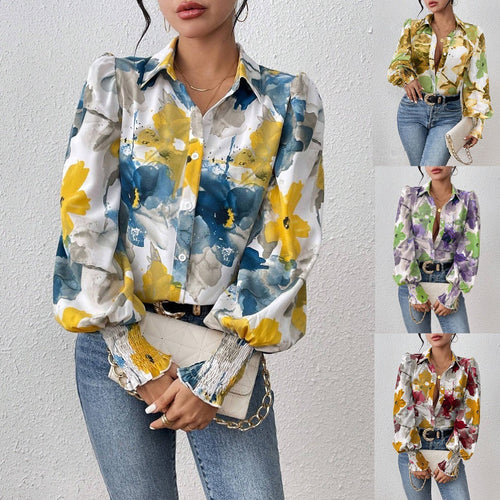 Dame elegant bluse med farverigt floralt design og afslappede puffærmer Stilla