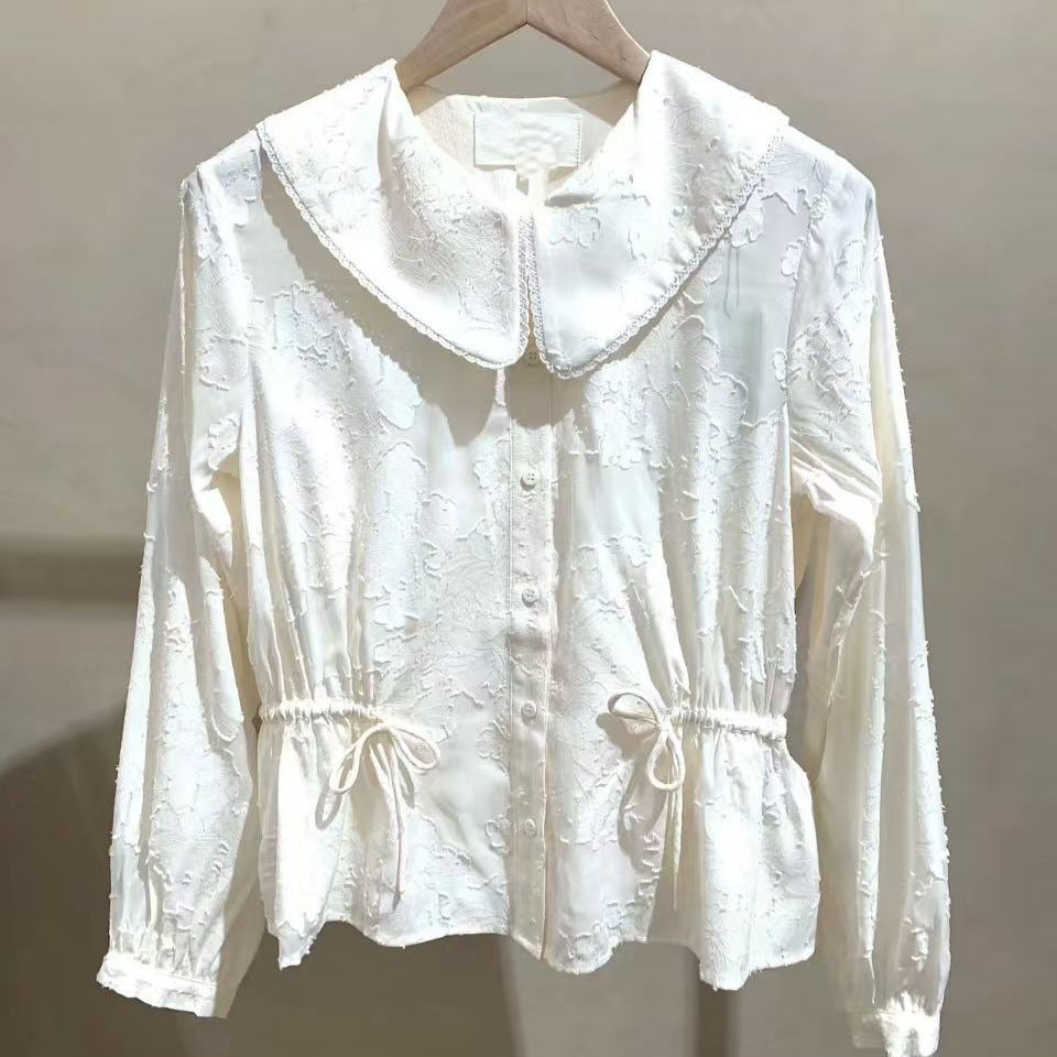 Damebluse med voluminøs krave og elastiske detalje i livet Stilla