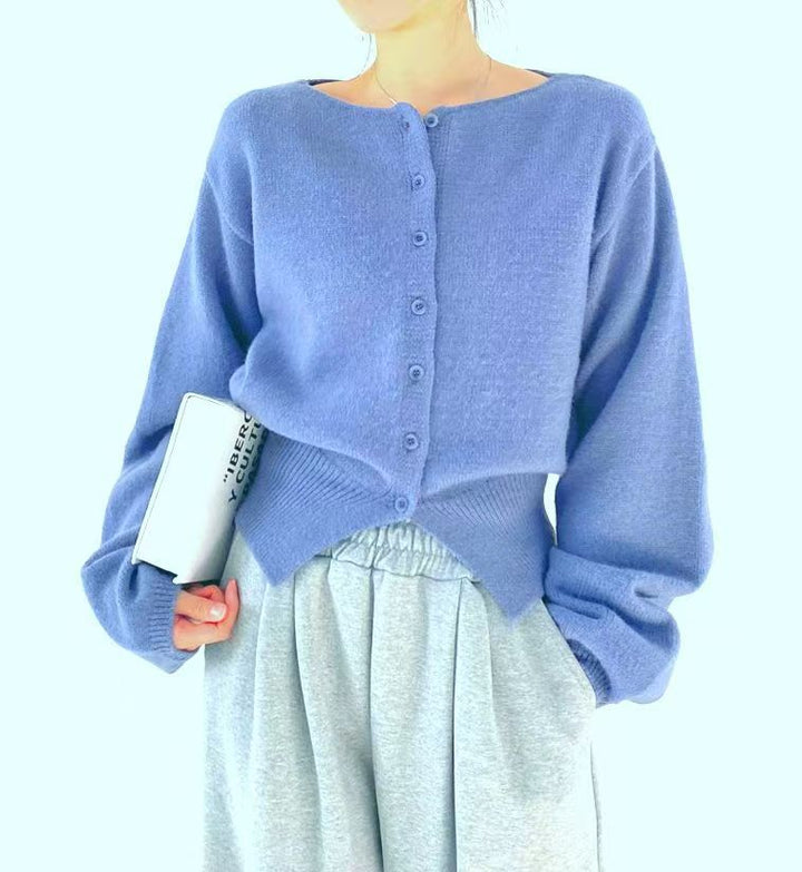 Kvinders crop sweater med knapdetalje og oversized ærmer Stilla