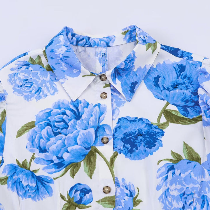 Damebluse med blomstermønster og elegante pufærmer Skovae