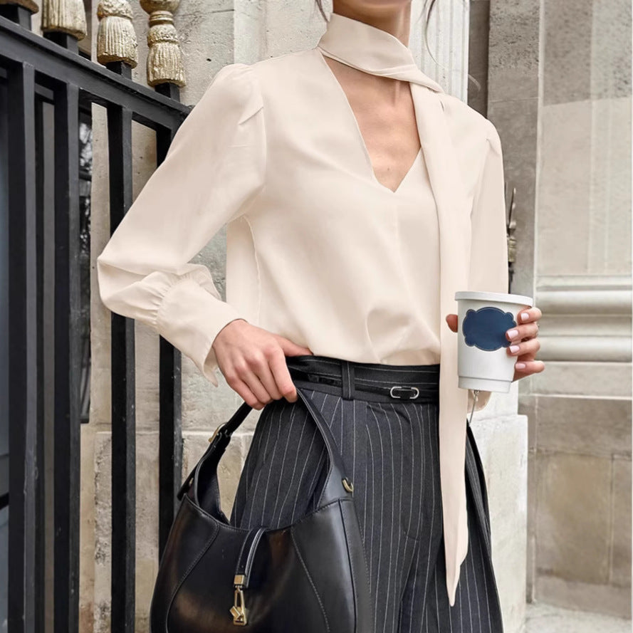 Dame elegant bluse med asymmetrisk binde detalje og voluminøse ærmer Stilla