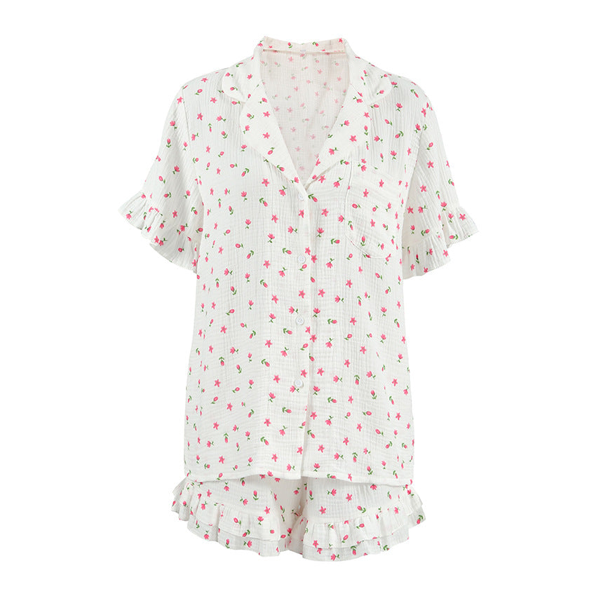Dame pyjamasæt med ruffle-detaljer og blomstertryk Stilla