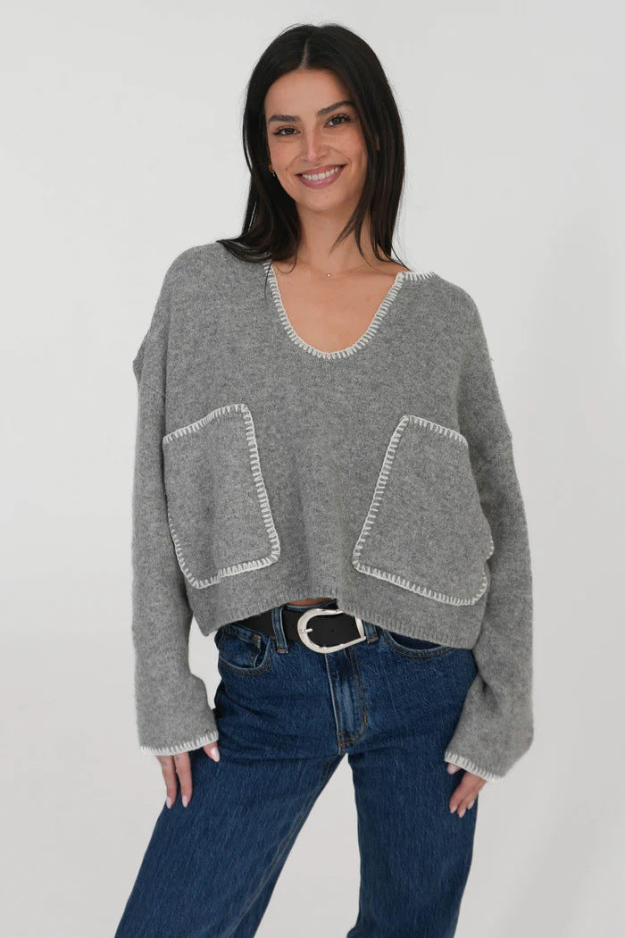 Kvinders hyggelige cropped sweater med asymmetrisk design og praktiske lommer Stilla