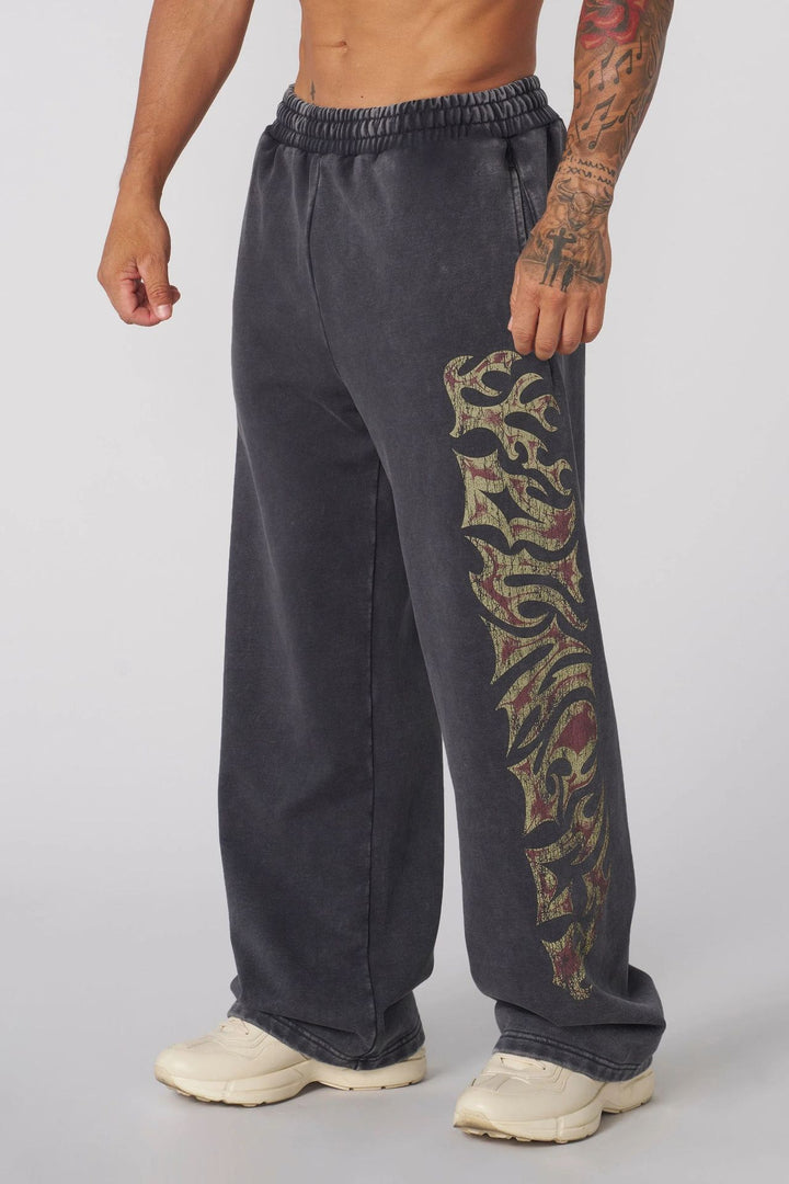 Herrer nan brede joggingbukser med elastisk talje, sidelommer og detaljeret kranium- og rosenmotiv Skovae