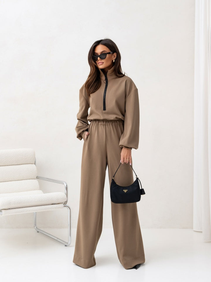 Dame sporty jumpsuit med høj krave og moderne lynlås Skovae