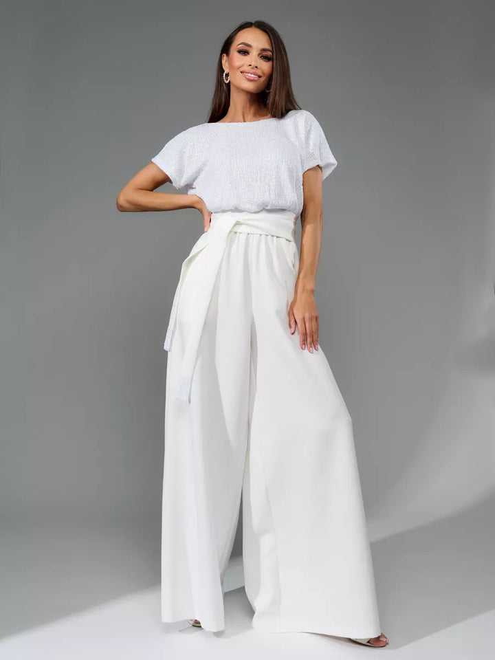 Dame glamourøs stil-outfit med glitrende top og bred pasform Skovae
