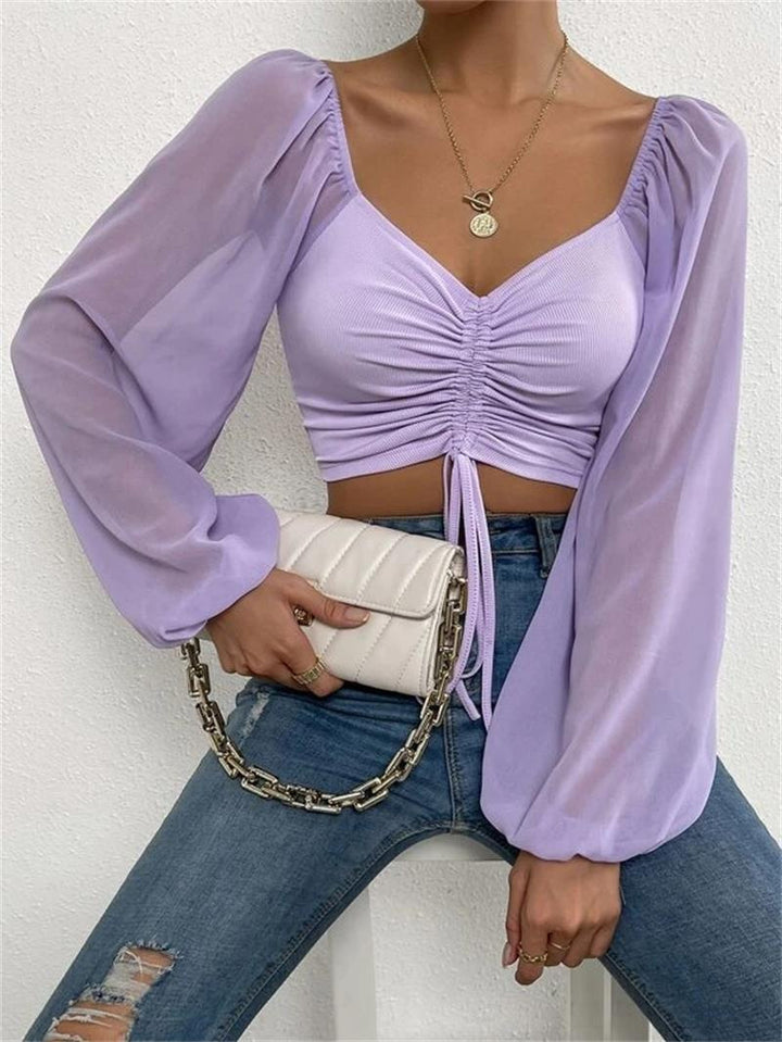 Dame Crop-Top med struktureret krop og elegante pufærmer Skovae