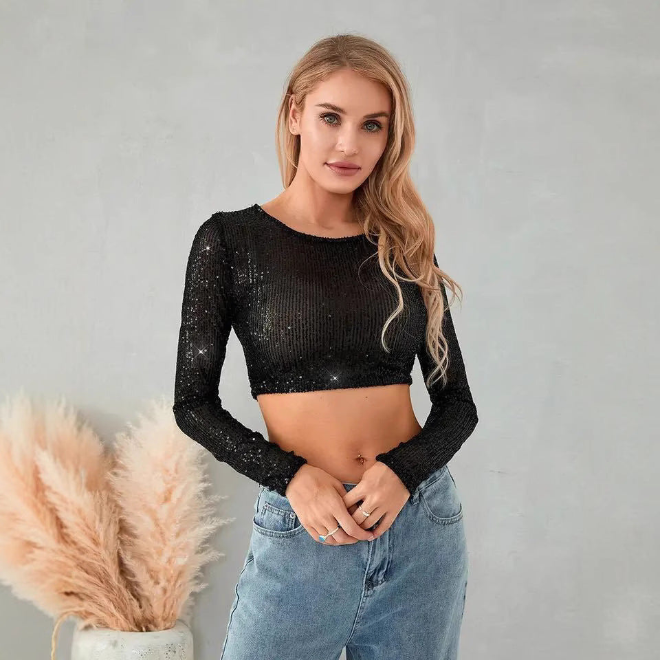 Kvindernes glitrende crop top med lange ærmer og tætsiddende pasform