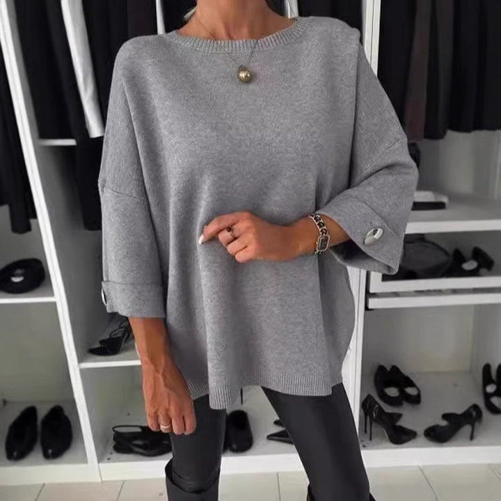 Dame elegant top med dekorative knapper og generøs pasform Stiila