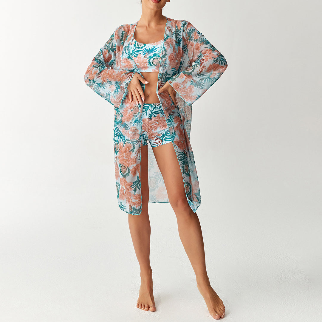 Dame strandoutfit med blomstret design og gennemsigtig kaftan Skovae