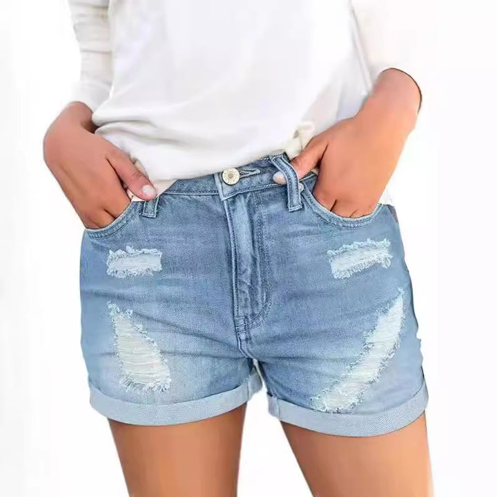 Dame jeansshorts med moderne rivdetaljer og afslappet snit Skovae