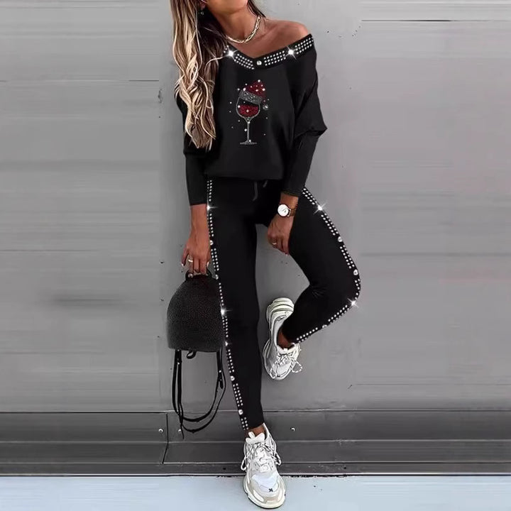 Dame sporty lounge sæt med off-shoulder top og glitrende detaljer Stilla