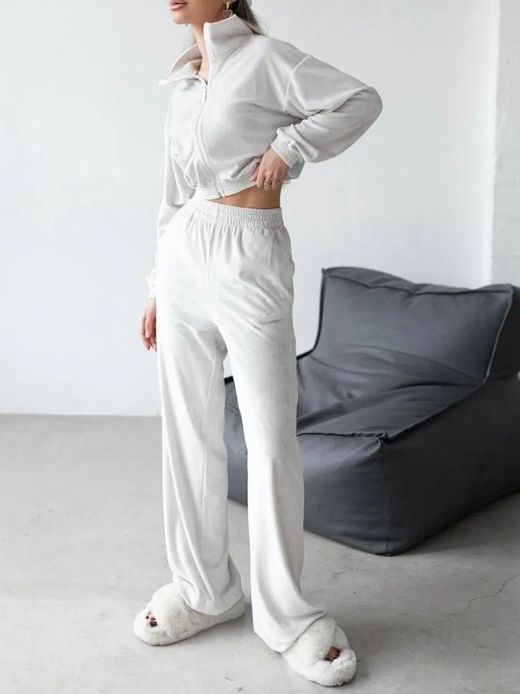 Kvinders fashionable velour sportsdragt med halv lynlås og elastiske manchetter Skovae