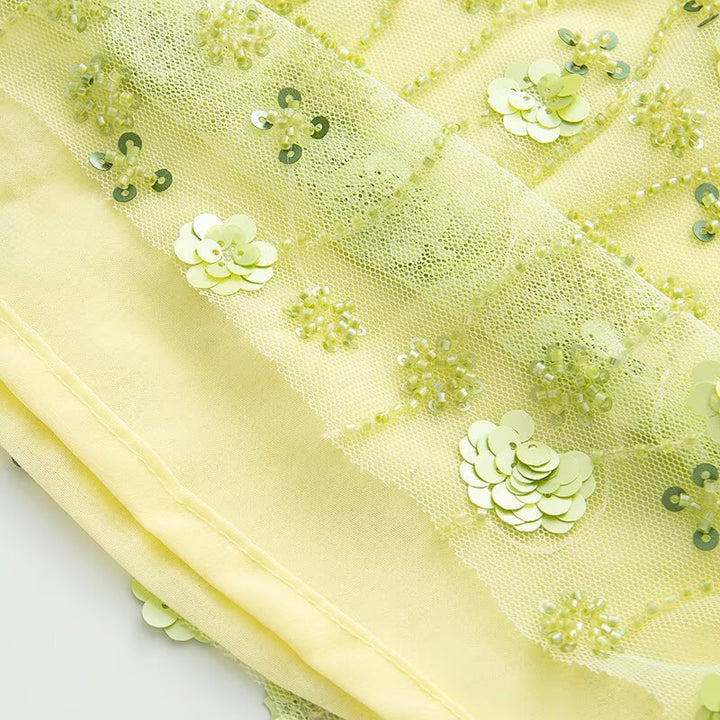Dame mini skirt med glitrende palietter og blomstret design Skovae