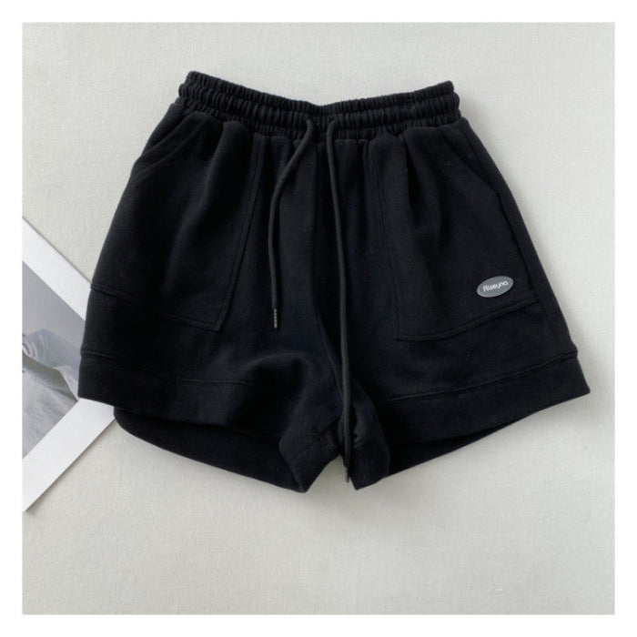 Kvindernes afslappede joggingshorts med elastisk talje og praktiske sidelommer