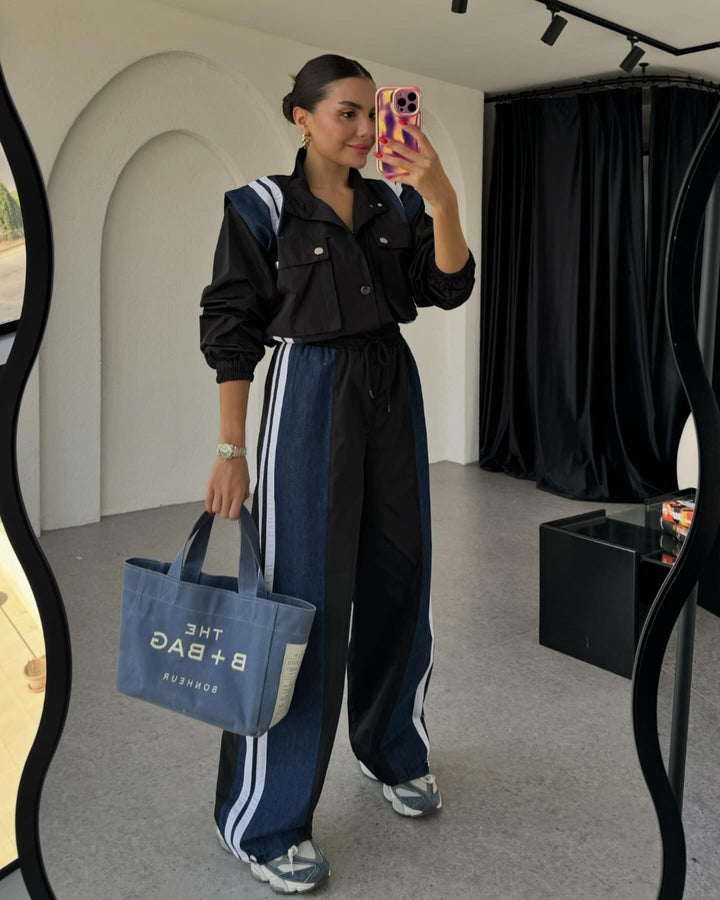 Dame sporty jumpsuit med sofistikeret snoreliv og kontraststriber Stilla