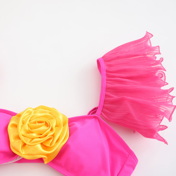 Dame én-delt badedragt med florale accenter og raffineret cut-out Stilla