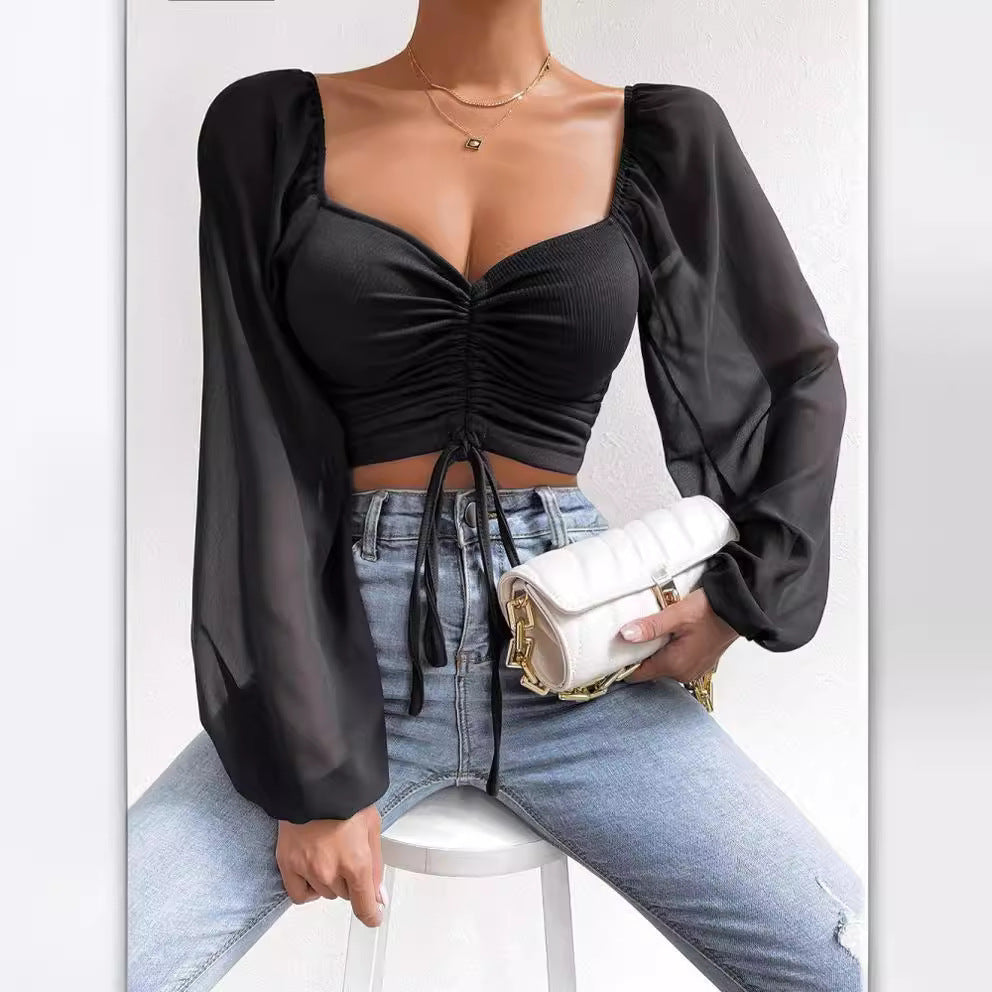 Dame Crop-Top med struktureret krop og elegante pufærmer Skovae