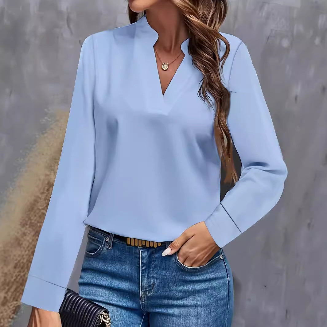 Dame elegant bluse i minimalistisk design med dekorativ V-udskæring og lange ærmer Stilla