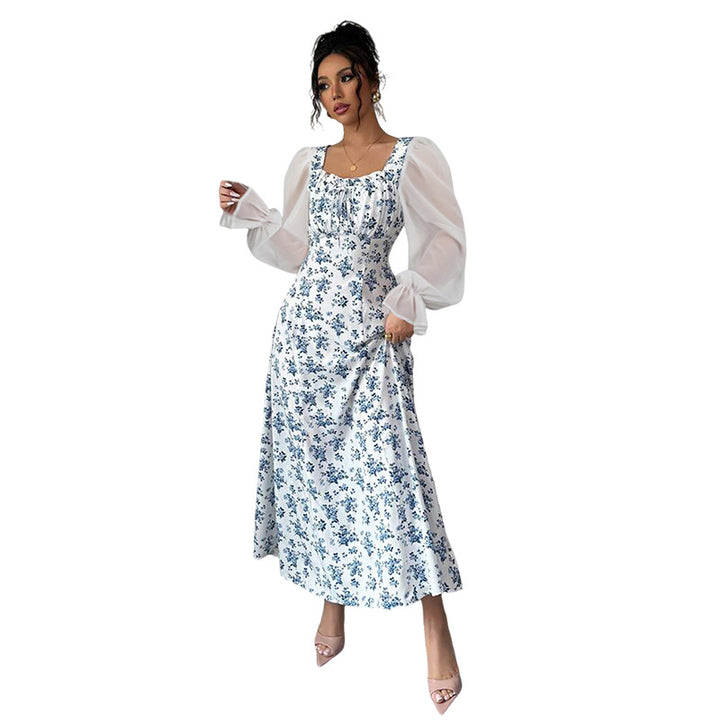 Dame Maxikjole med transparente pufærmer og blomsterdesign Stilla