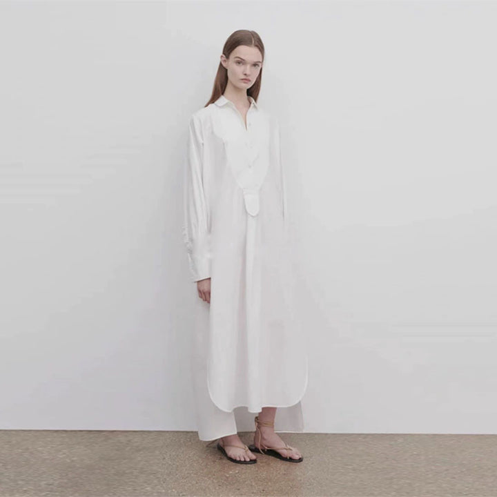 Dame langærmet skjorte med elegant knaplås og asymmetrisk kant Stilla