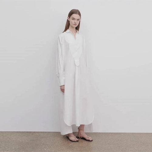 Dame langærmet skjorte med elegant knaplås og asymmetrisk kant Stilla