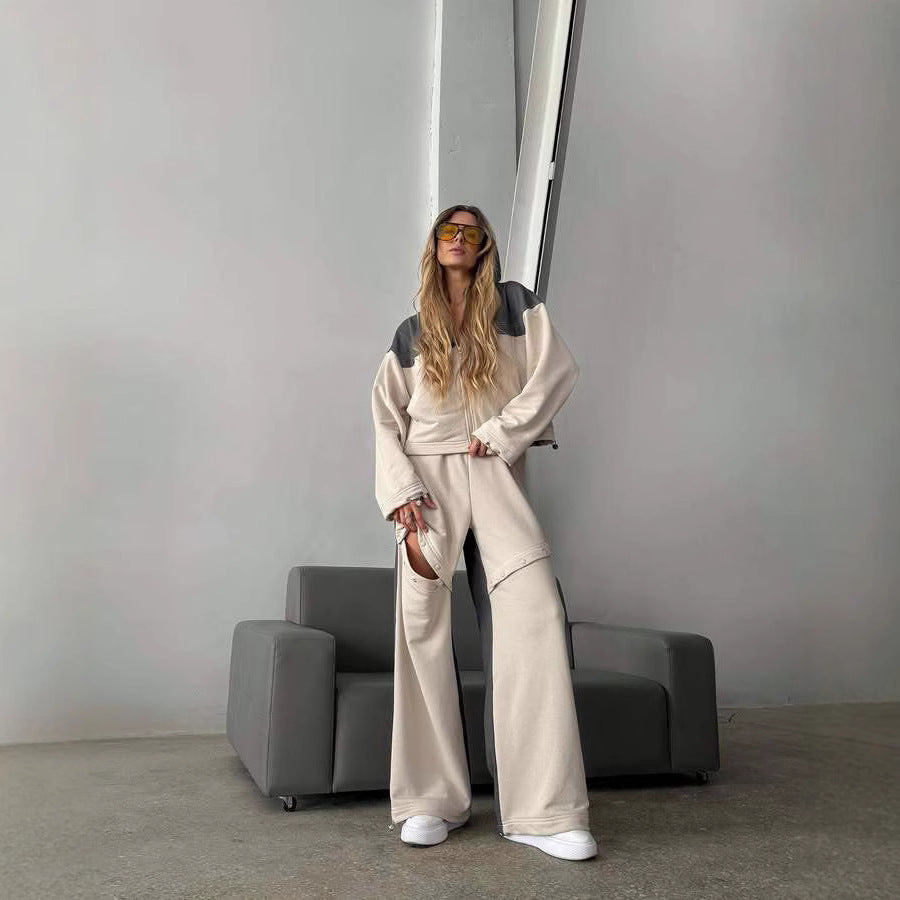 Kvinders fashionable casual outfit med sporty jakke og kreativt udskårne bukser Skovae