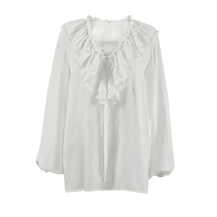 Damebluse med voluminøs flæse nederst og elegant snøring Stilla