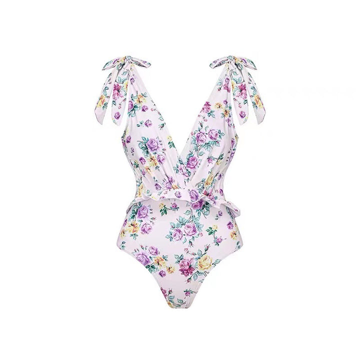 Dame heldragt badedragt med floralsk design og elegant omslagsskørt Stilla