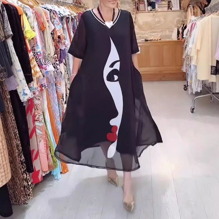 Dame nan lette chiffon maxikjole med grafisk ansigtstryk, V-hals og sidelommer Skovae