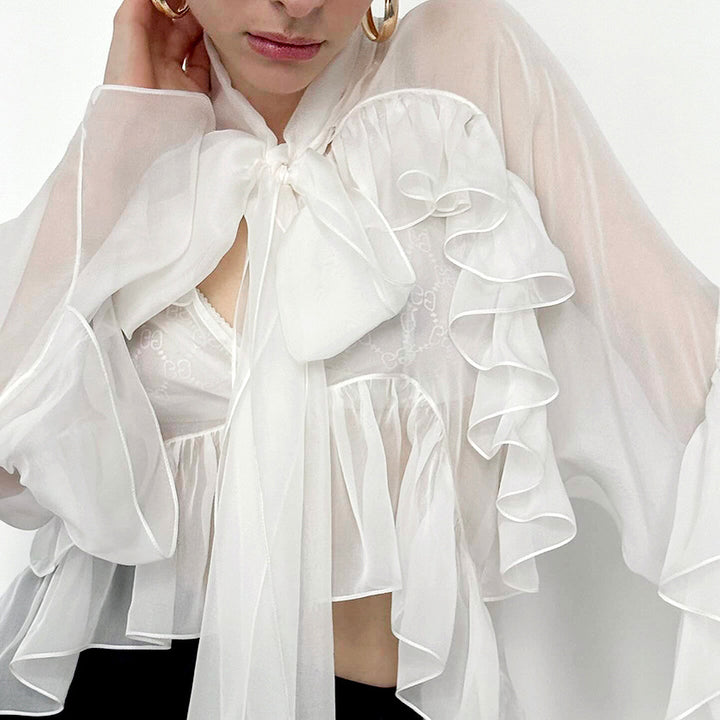 Dame Transparent Rynkebluse med voluminøse ærmer og elegant design Stilla