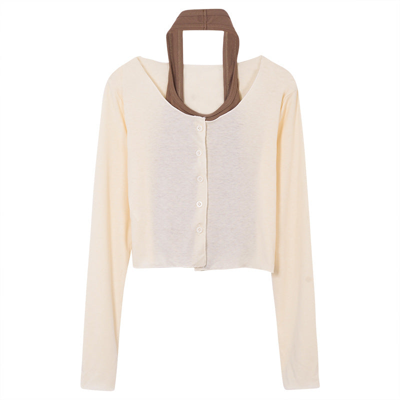 Kvinders langærmet crop top med knaplukning og elegant design