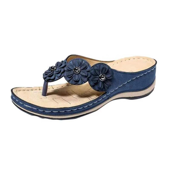 Dame slip-in sandaler med elegante blomsterapplikationer og ergonomisk sål Stilla