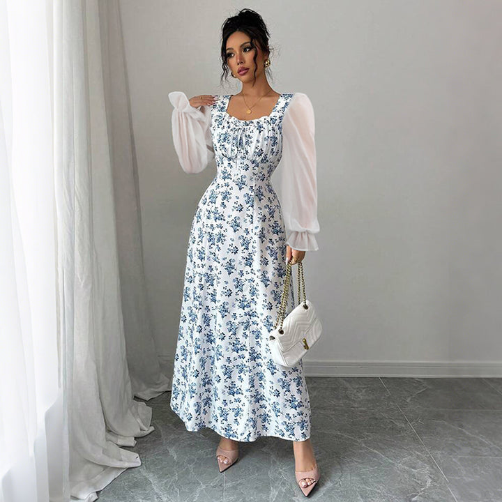 Dame Maxikjole med transparente pufærmer og blomsterdesign Stilla