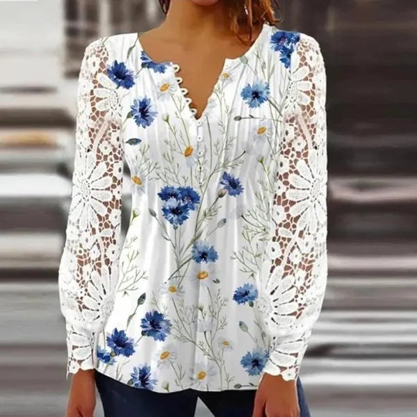 Damer spidsbluse med elegante knapdetaljer og voluminøse ærmer Stilla