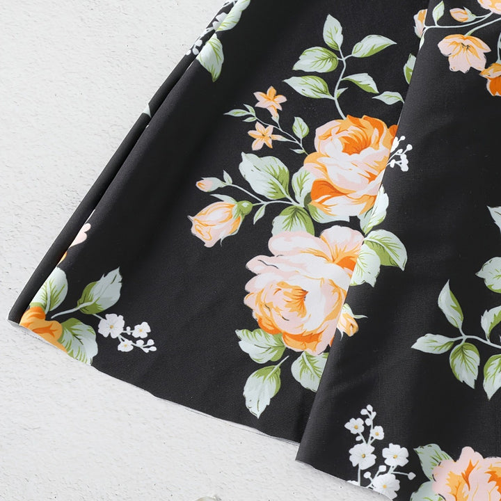 Dame én-delt badedragt med ruffledetails og blomstret design Skovae