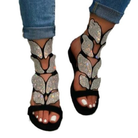 Dame Glitrende Sandaler med blomsterdesign og elegant rem Stilla